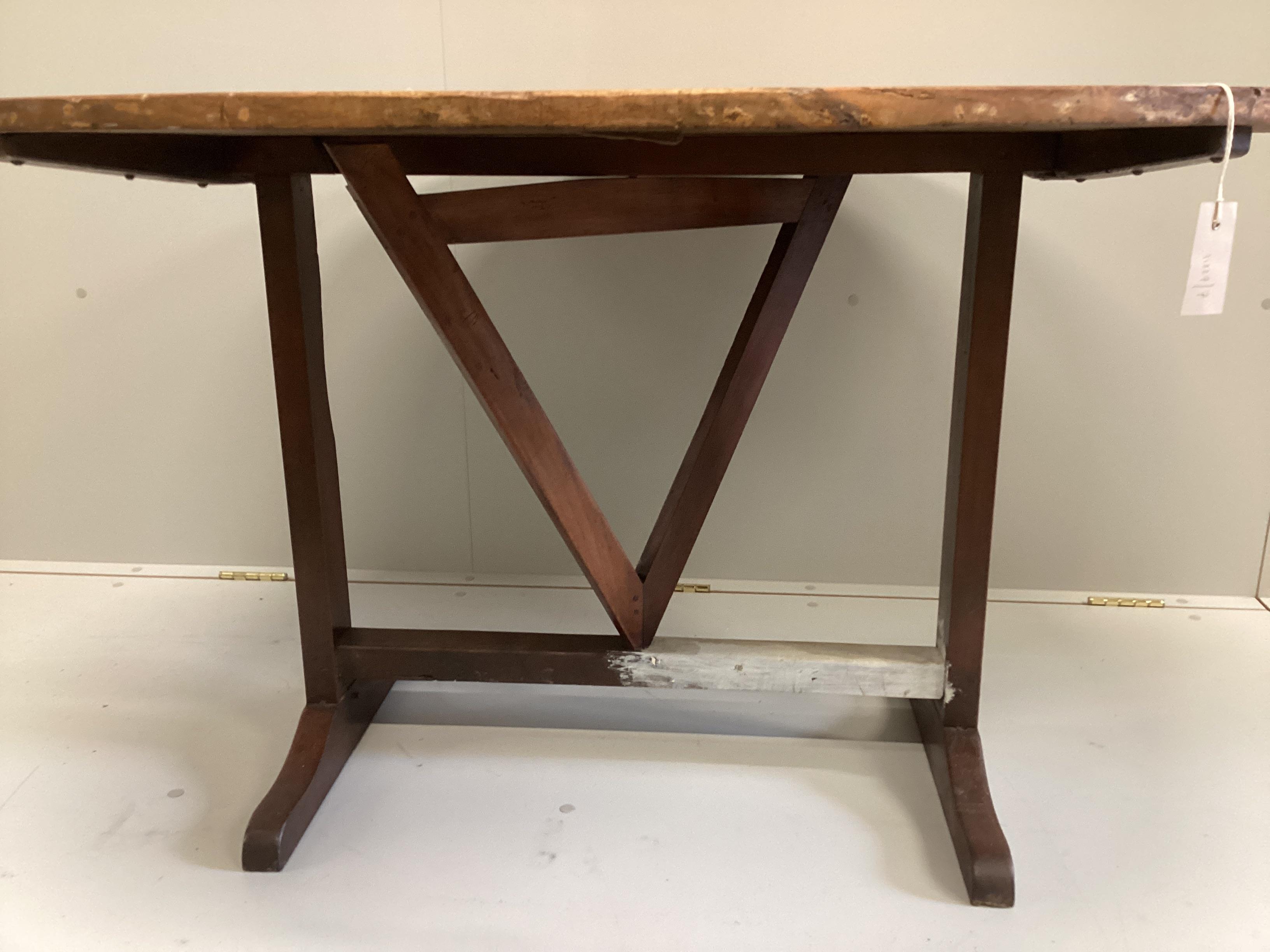 A 19th century French oval pine and fruitwood Vigneron, width 125cm, depth 101cm, height 72cm